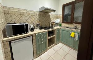 Kuchyň nebo kuchyňský kout v ubytování Villa Lidia