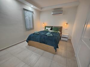 Ένα ή περισσότερα κρεβάτια σε δωμάτιο στο San Agustin Ocean View Terrace