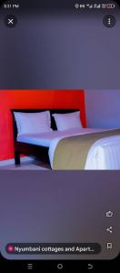 Cama ou camas em um quarto em NYUMBANI CITY CENTER ACCOMODATION