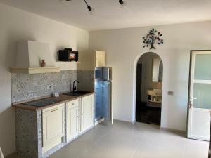 Kuchyňa alebo kuchynka v ubytovaní Garden Relais Le Fontanelle