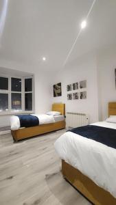 Uma cama ou camas num quarto em 3 Bedroom, 3 Bathroom, Modern Apartment, Leicester