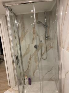 a shower in a bathroom with a glass at Room 248 Capodimonte in Naples