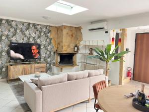 a living room with a couch and a fireplace at Casa Vacanza Fiera di Roma in Ponte Galeria