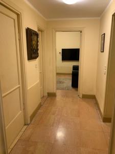 A television and/or entertainment centre at Prime location 2 bed rooms Apartment , near the Nile & Cairo Center