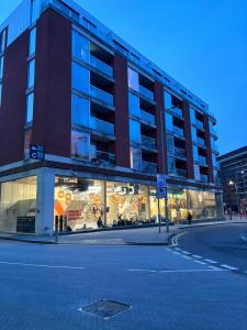 a store front of a building on a street at LUXURY Leicester apartment in Leicester