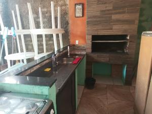 a kitchen with a sink and a counter top at Espaço com piscina in Sorocaba