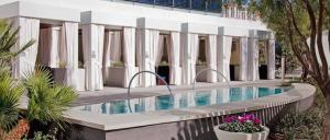 a swimming pool in front of a building at Corner Suite at Vdara Hotel and Spa in Las Vegas