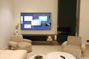 TV i/ili multimedijalni sistem u objektu Villa Kam