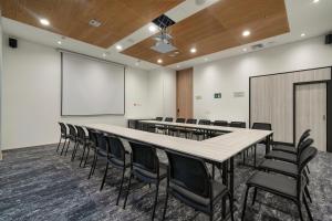 a conference room with a large table and chairs at Hotel Distrito ZF in Bogotá