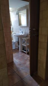 a bathroom with a white sink and a mirror at MasRelaxTenerife in La Laguna