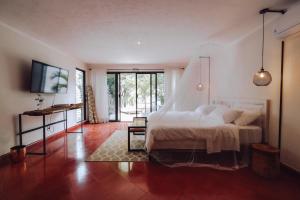 Postel nebo postele na pokoji v ubytování Hotel Boutique KAA