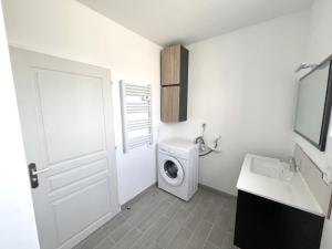 a white bathroom with a washing machine and a sink at 178B - Appartement T2 Tout Confort - Wifi Netflix in Le Gond-Pontouvre +11 photos