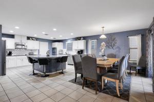a kitchen and dining room with a table and chairs at Tranquility - A Birdy Vacation Rental in San Antonio