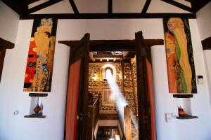 a hallway with an open door in a building at Las Casas del Nogal - Guesthouse en Sierra Nevada in Güéjar-Sierra