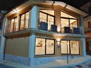 a building with a balcony on top of it at Da Mario Affittacamere in Gioia Tauro