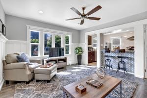 a living room with a couch and a table at East Village Apartments in Long Beach
