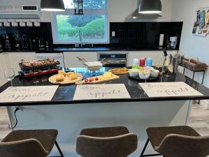a kitchen with a counter with some food on it at Newly Renovated villa with magnificent views in Coaticook
