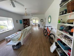 a room with a bed and a bike in it at Bahamian Farm House in Rock Sound