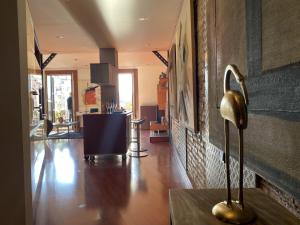 a living room with a lamp on a table at Luminous Designer Loft Style Apt Eixample Views By MyRentalHost in Barcelona