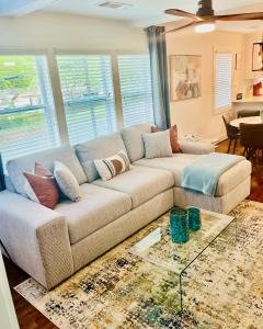 a living room with a couch and a table at GROVE PARK- ‘Newly Renovated’ home- just mins from Midtown/Downtown Atlanta. in Atlanta