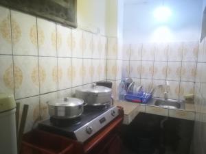 Kuchyň nebo kuchyňský kout v ubytování Appartement meublé Douala Bonapriso Savio + 1 fotografie