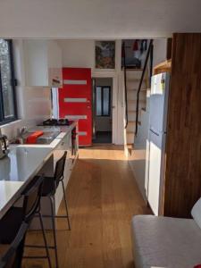 a kitchen with a white refrigerator and a counter top at Bottletree Gardens Mini Mansion Red in Lower Beechmont +39 photos