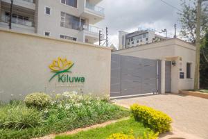 a building with a logo on the side of it at Kiluwa Apartments by Dunhill Serviced Apartments in Nairobi
