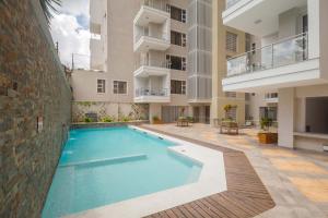 a swimming pool in the middle of a building at Kiluwa Apartments by Dunhill Serviced Apartments in Nairobi