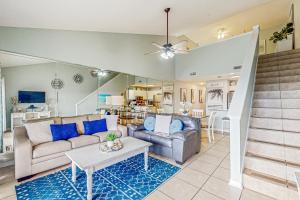 a living room with a couch and a table at Maravilla 4409 in Destin