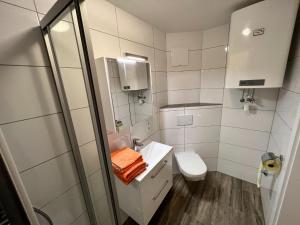 Ένα μπάνιο στο Apartment Bodensdorf near Ski & Lake