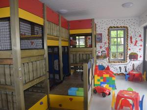 a room with a bunk bed and a playroom at Beautiful holiday home in Waxweiler in the Eifel in Waxweiler