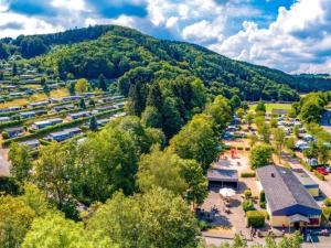an aerial view of a parking lot with a mountain at Beautiful holiday home in Waxweiler in the Eifel in Waxweiler