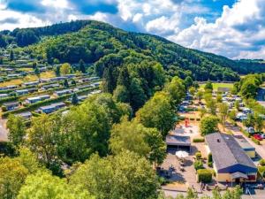 an aerial view of a parking lot with a mountain at Luxurious bungalow in Waxweiler in the Eifel in Waxweiler