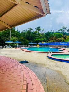 an empty swimming pool with two swimming pools at Chalet Cerro azul in Cerro Azul