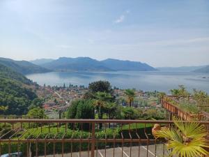 a view of a body of water from a balcony at Lovely holiday home with private terrace in Maccagno Inferiore