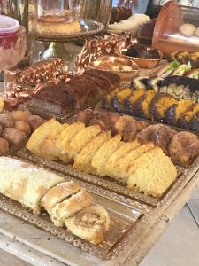 a buffet of different types of bread and pastries at Shanti Life in Búzios