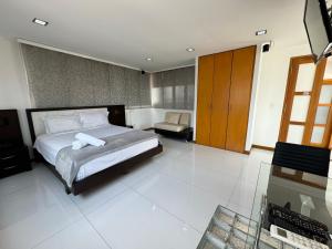 מיטה או מיטות בחדר ב-HOTEL SAN ANTONIO PLAZA