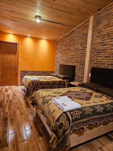 Rúm í herbergi á Cabañas en Zacatlán