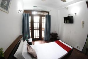 Postel nebo postele na pokoji v ubytování Oasis Colombo
