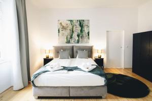 מיטה או מיטות בחדר ב-Charmantes Apartment mit Terrasse
