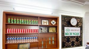 a store with a bunch of soda bottles and a clock at Bích Ngọc Hotel Hà Nội in Hanoi