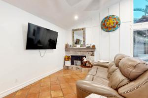a living room with a couch and a fireplace at Sunset Lane in Tempe