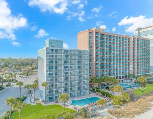 an aerial view of a large building with a pool at Indigo in Myrtle Beach