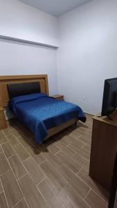 Postel nebo postele na pokoji v ubytování El Rincón de Tita