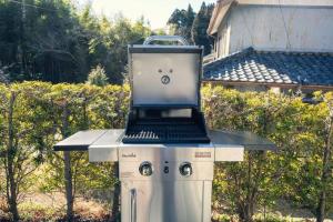 a laptop computer sitting on top of a barbecue grill at Rokuan in Kikugawa