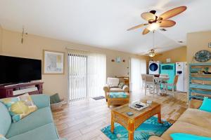 a living room with a couch and a table at Salt, Sand, Sea in North Port