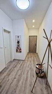 an empty room with a wooden floor and a door at Ljubljana Central Cozy Apartment w Free Parking in Ljubljana
