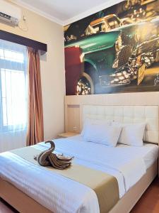 Voodi või voodid majutusasutuse Ayuri Hotel Malioboro toas