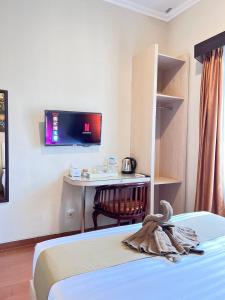 Voodi või voodid majutusasutuse Ayuri Hotel Malioboro toas