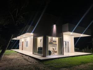 a small house is lit up at night at Departamentos Sosucro in Montero